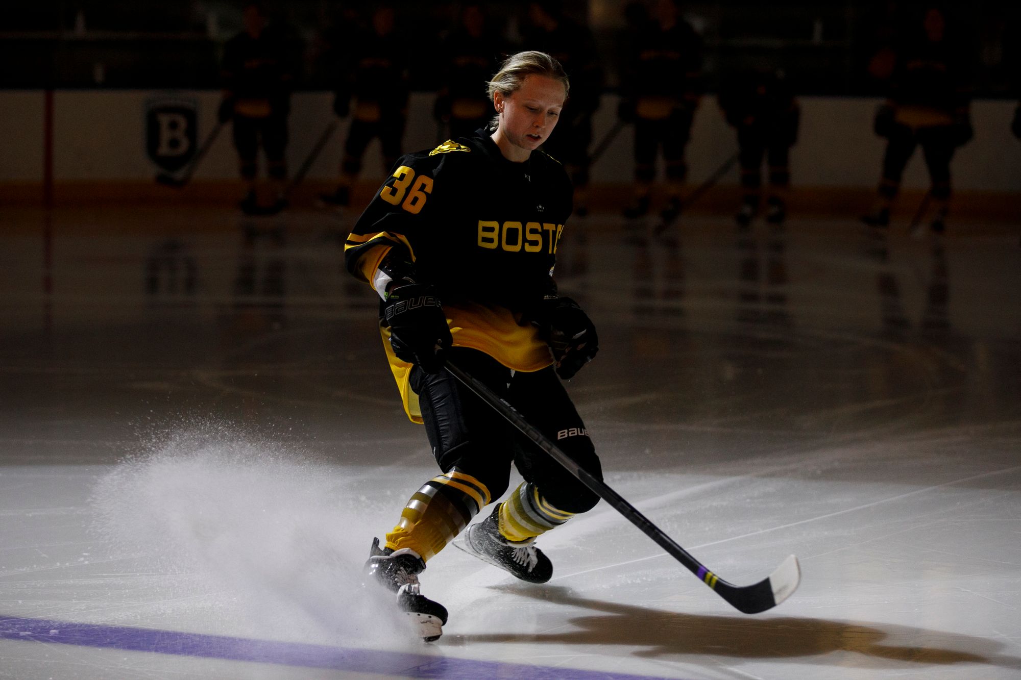 Loren Gabel skids to a stop on the blue line as the Pride's starting lineup is announced.