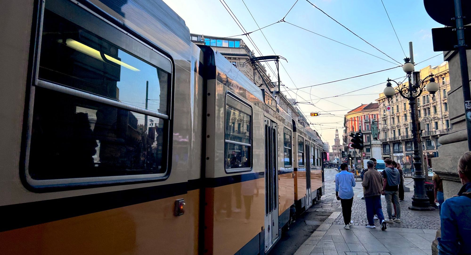 scenic picture of a tram in Milan in the middle of the city