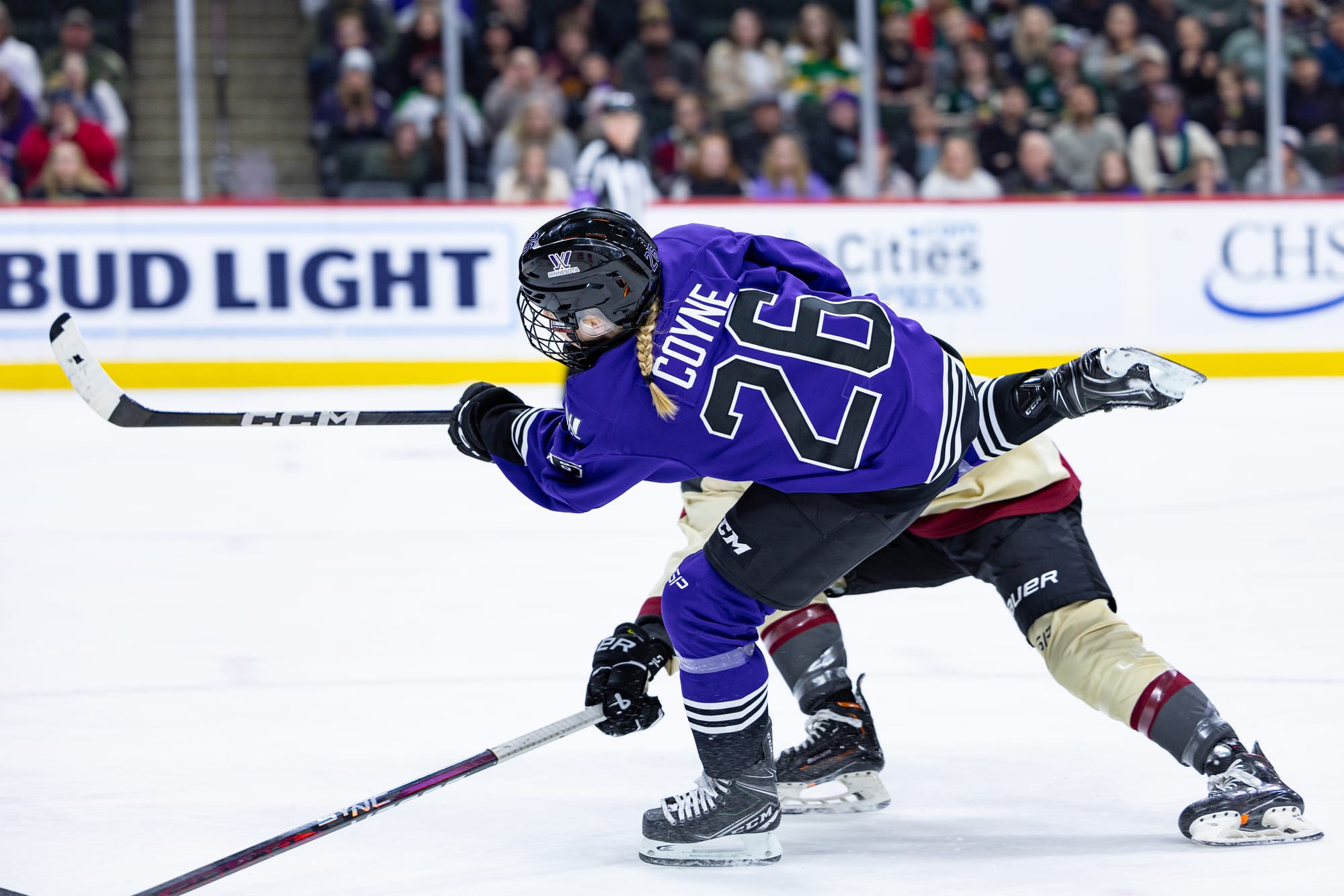 Kendall Coyne Schofield, wearing a purple home uniform, takes a shot against Montréal.