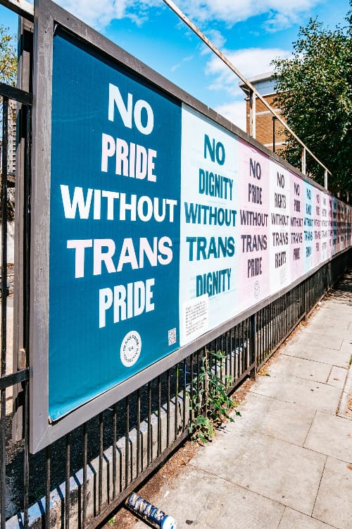 a sign on a fence that says no pride without transs pride