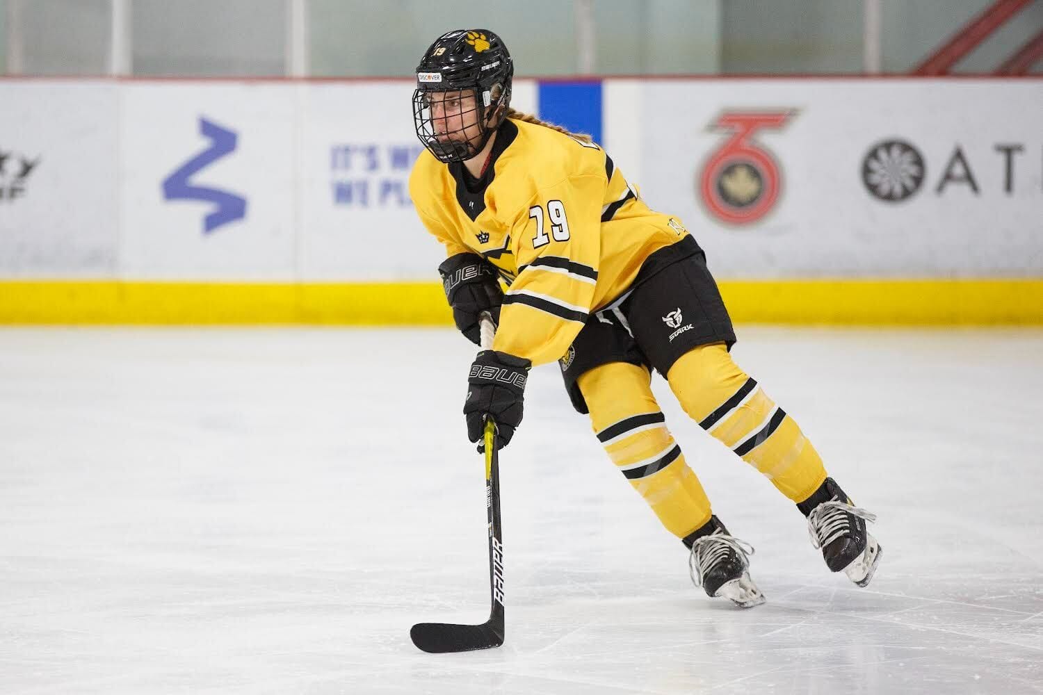 Davis in a yellow Boston Pride jersey during a PHF game.