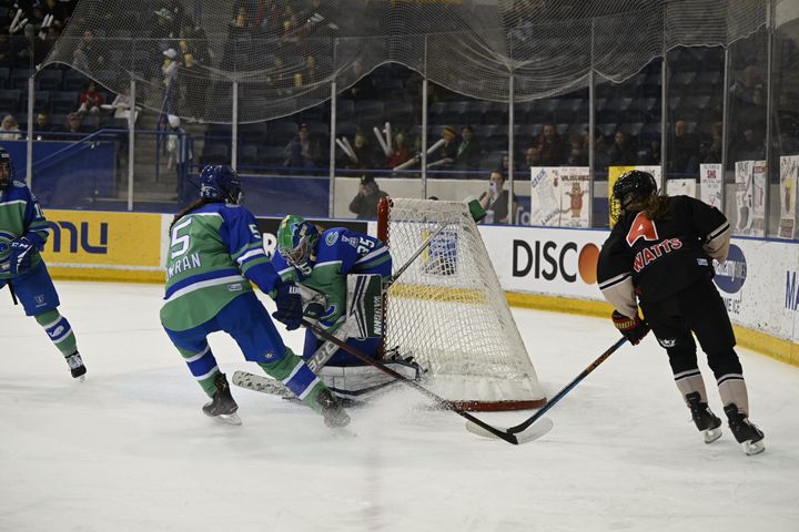 Abbie Ives of the Connecticut Whale making a save on Daryl Watts of the Toronto Six.