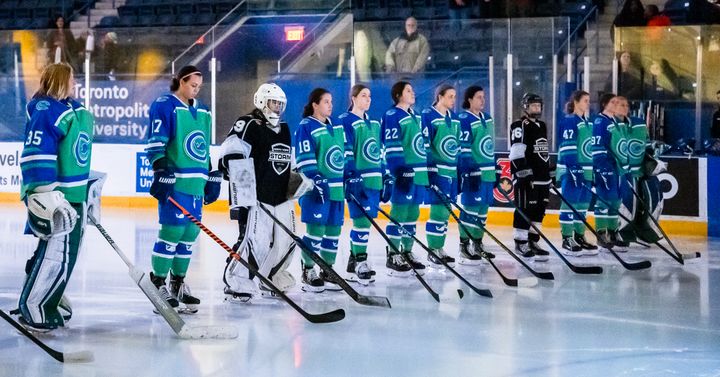 The Connecticut Whale stand at the blueline at Mattamy Athletic Centre for the anthem. 