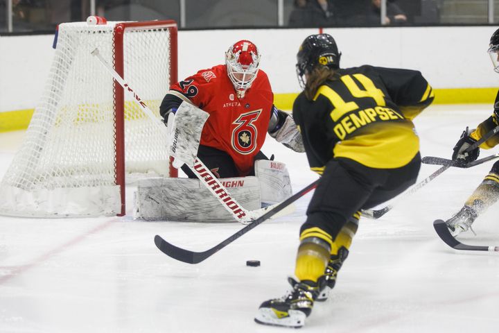 Jillian Dempsey heads towards Elaine Chuli in net