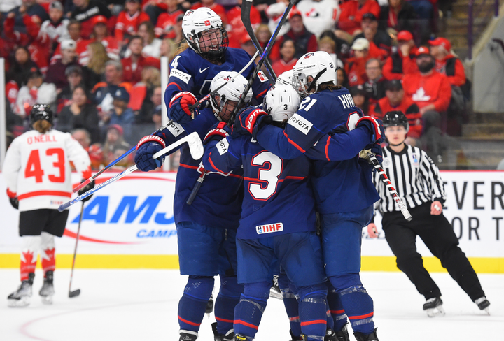 Team USA celebrates a goal against Team Canada