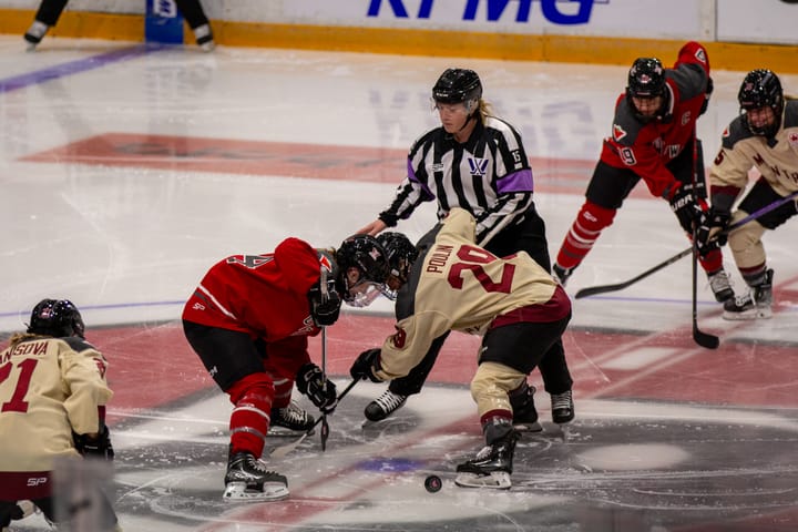 Marie-Philip Poulin wins the opening faceoff of Tuesday's PWHL game