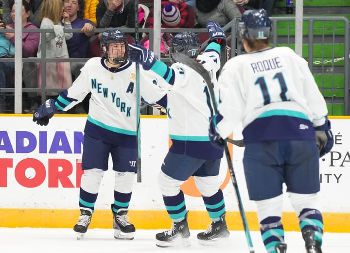 Alex Carpenter celebrates a goal with Ella Shelton and Abby Roque of PWHL NY. (Cred: PWHL)