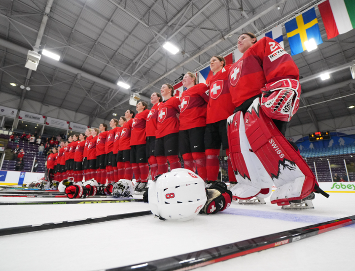 Switzerland listens to their national anthem after beating Japan