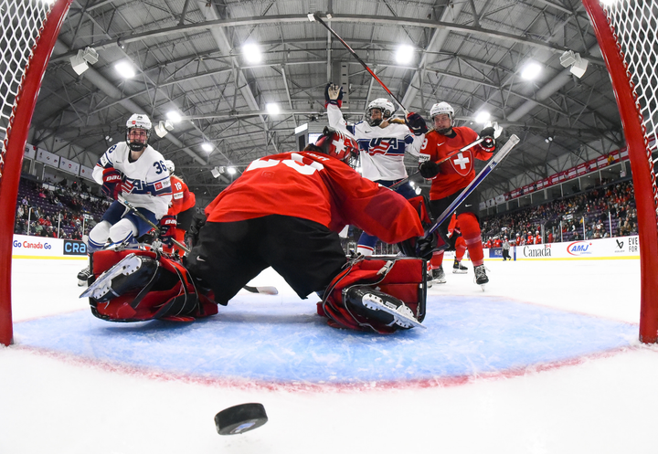 A view from inside the goal, just as the US scores against Swizerland. USA players are celebrating in the background.