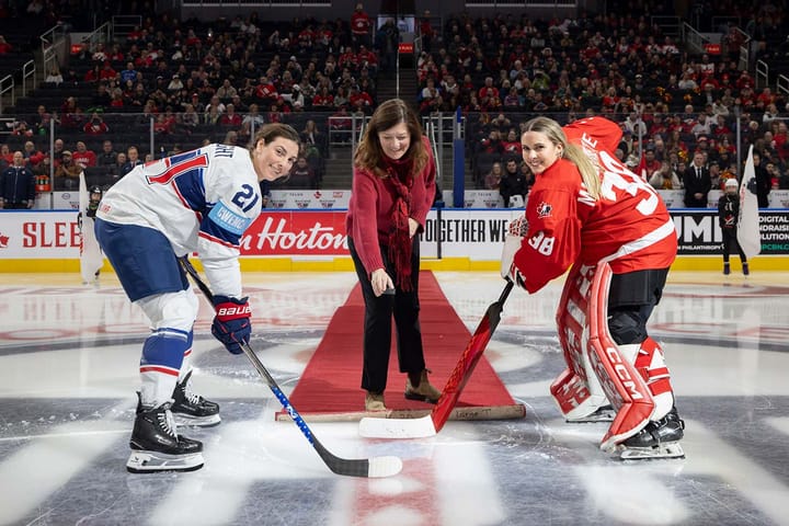 Hilary Knight and Emerance Maschmeyer pose for the ceremonial face-off