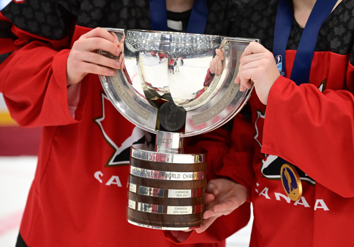 The IIHF U18 World Championship trophy being held by Canada